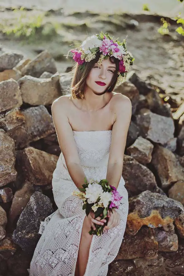 bride wears flower crown at her wedding